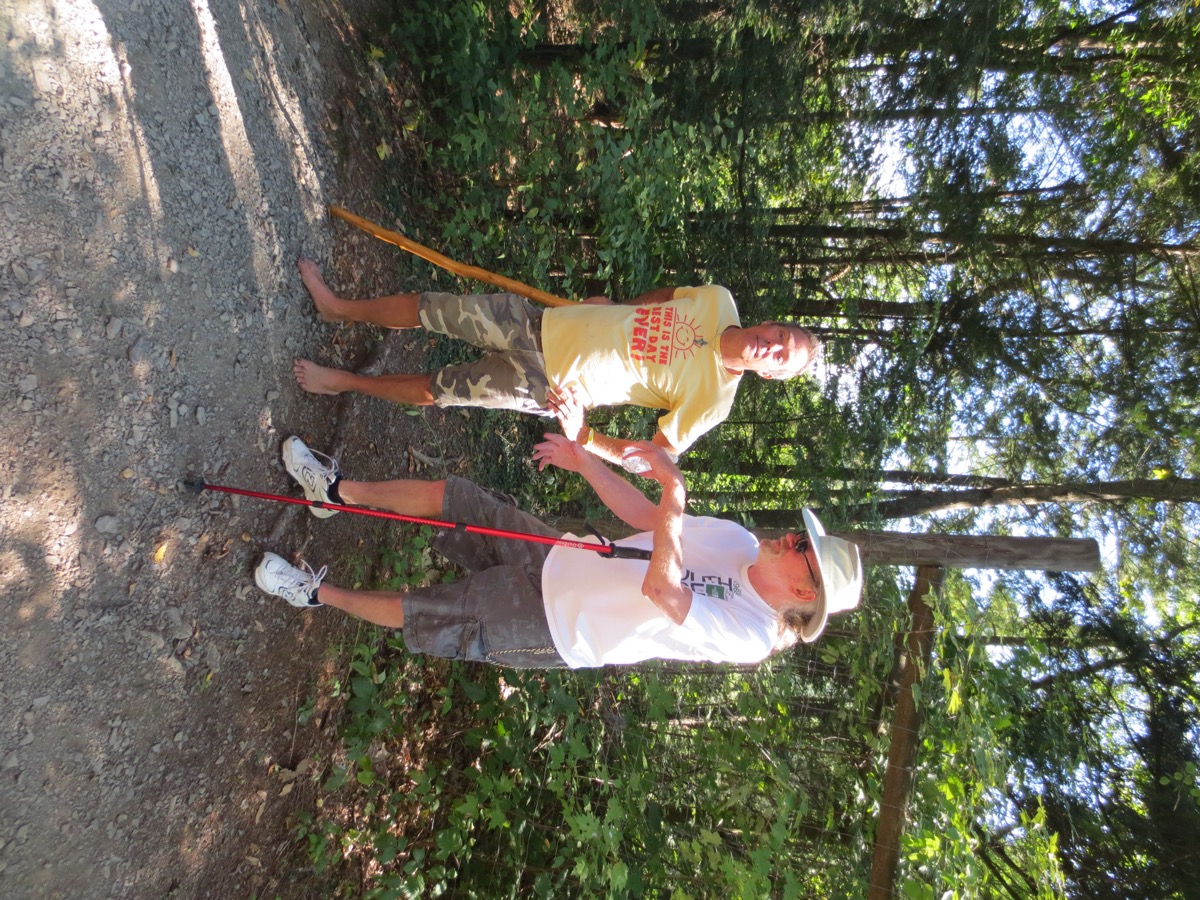 a Barefoot Hiker stops to chat with a friend on the trail