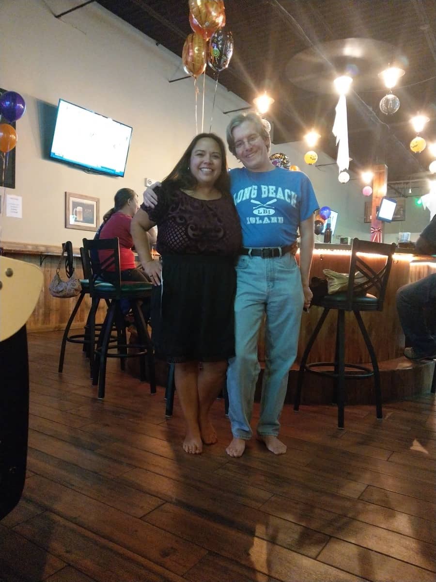 Chris and Jacqui grab a drink barefoot at a local bar after a barefoot hike