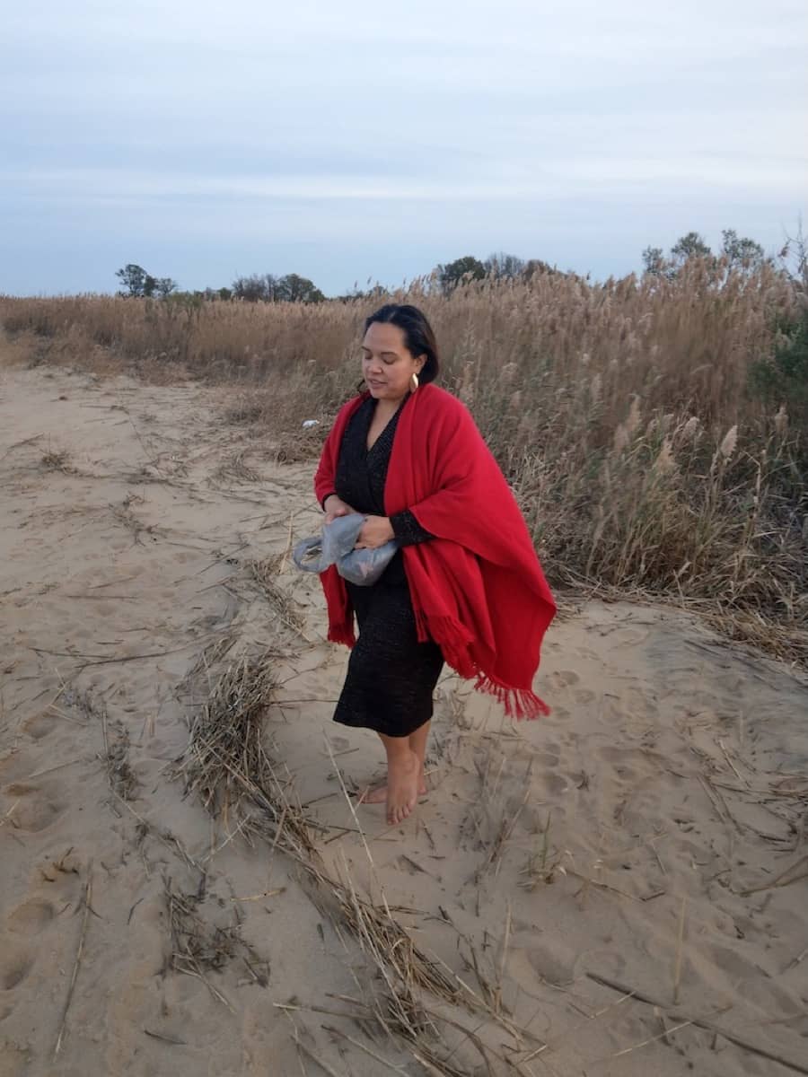 Jacqui enjoys the sandy beach beneath her feet